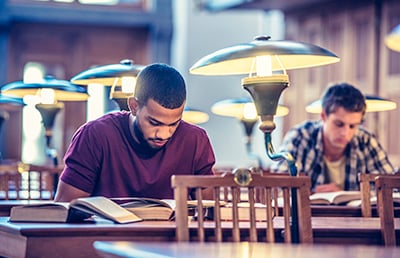Man studying in library