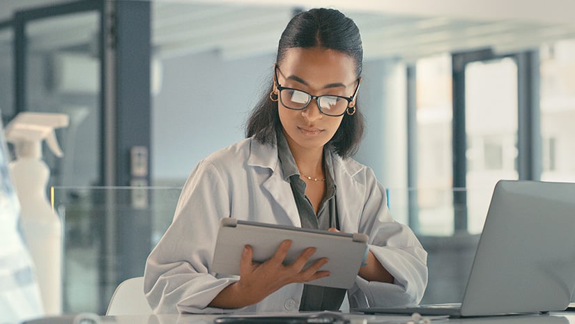 Young Female Doctor Using Her Digital Tablet