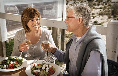Couple Having Lunch and Wine on Deck