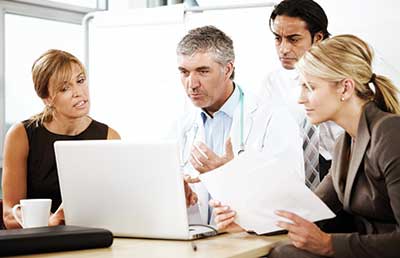 Doctor Collaborating with a Business Team