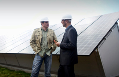 Two men solar panels