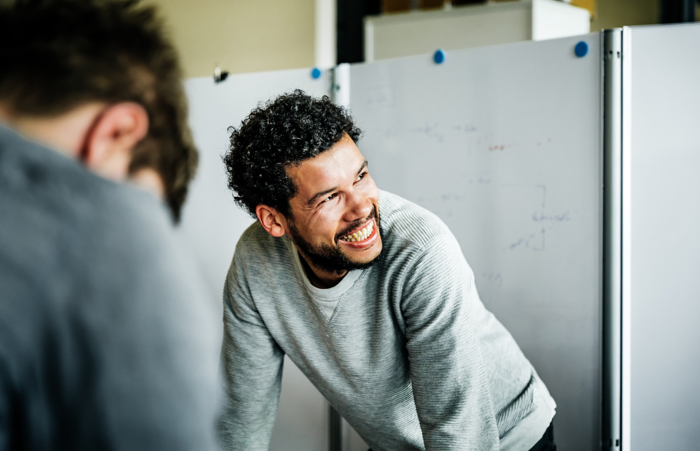 Casual business man smiling in meeting
