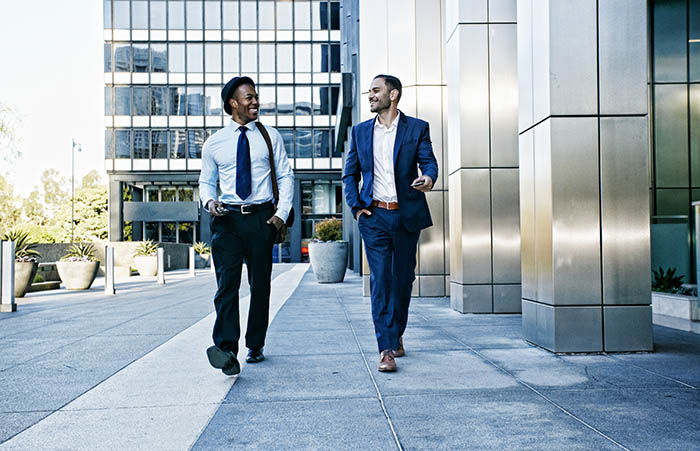 BusinessmenTalkingOutsideOfficeBuilding