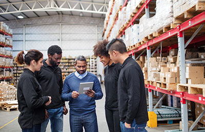 <img src=”warehouse.jpg” alt=”coworkers in warehouse”>