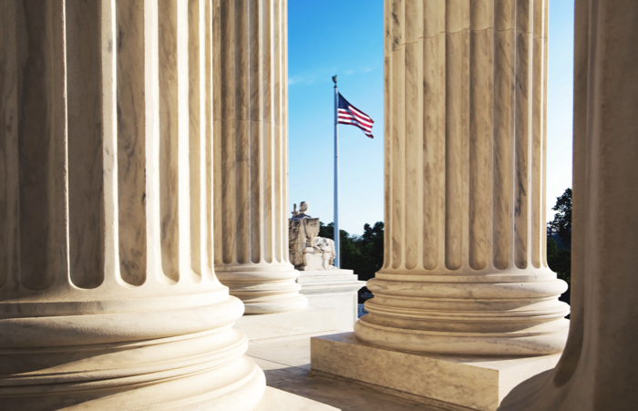 American flag through columns