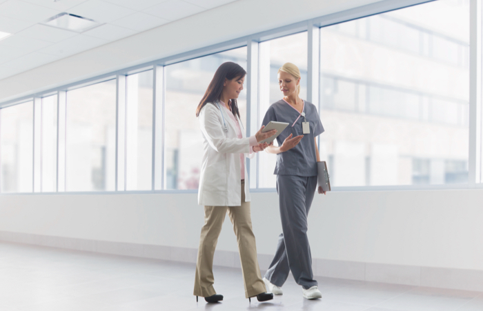 Doctor and nurse talking in hospital