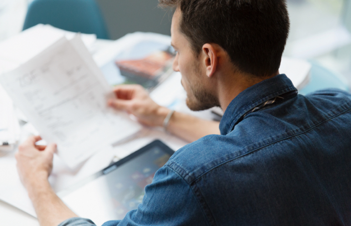 Man reviewing invoices