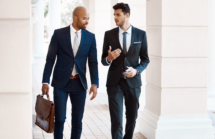 twobusinessmenwalkingoutside
