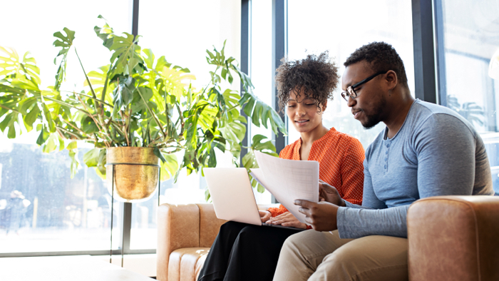 Couple review tax paperwork