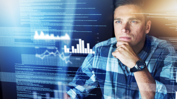 Cybersecurity analyst looking at data