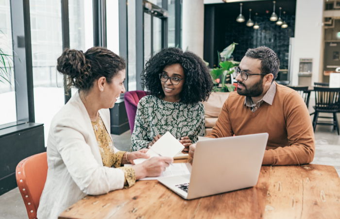 Couple planning their financials with advisor