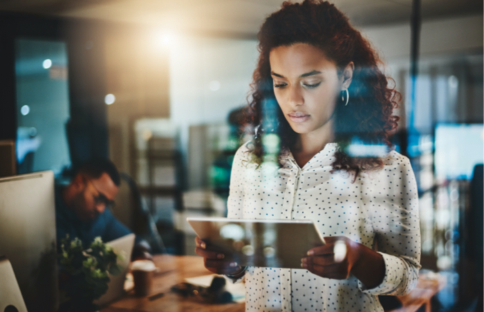 Women on tablet in office