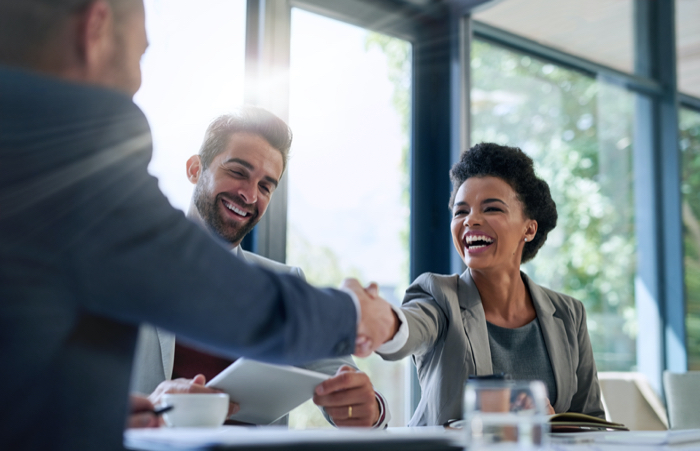 BusinessPeopleShakingHandsinMeetingW700x451