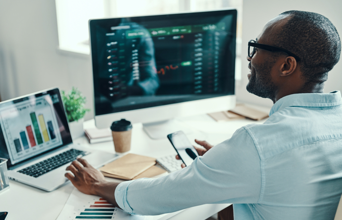 Man Checking Stockson Computer