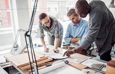 Three Architects Reviewing Plans