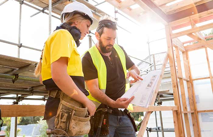 Two Workers Reviewing Plan