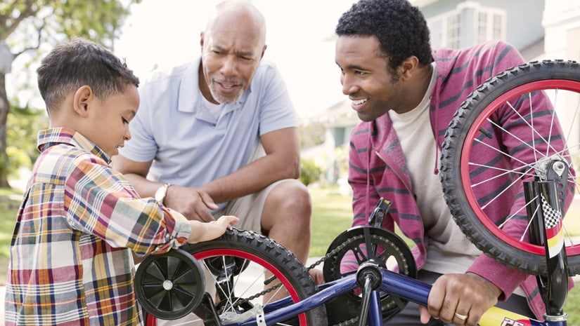 Grandfather Dad and Son Fixing Bike