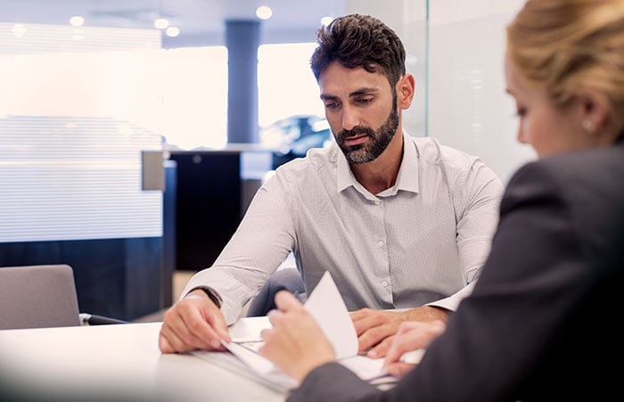Beard Guy Reviewing Document