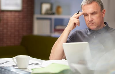 Business Owner At Desk Thinking