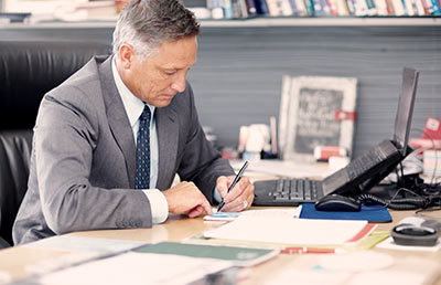 Businessman Signing Papers
