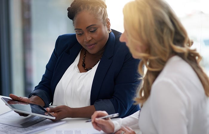 Colleagues Share Info on Tablet