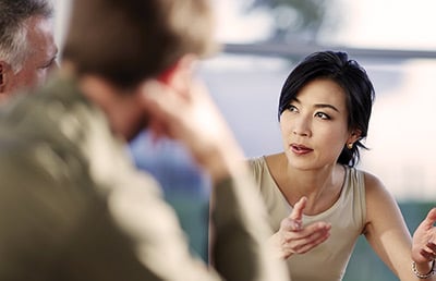 Foreign Businesswoman Talking in Meeting