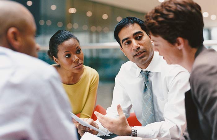 Four Professionals Discussion Conference Table