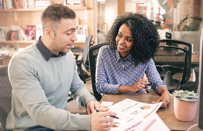Man and Woman Reviewing Paperwork