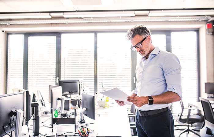 Man Big Watch Reading Document