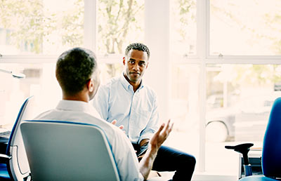 Man Discussing with Hand Gestures
