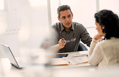 Man Holding Glasses Discussion