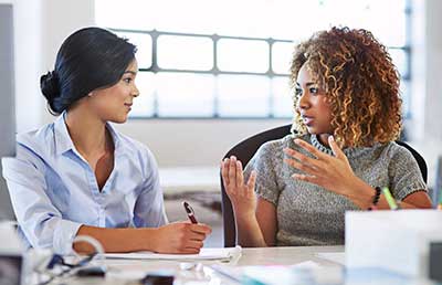 Professional-Women-Discussion-Taking-Notes