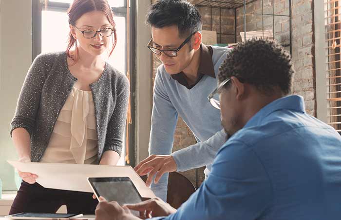 Teammates Collaborating on Project