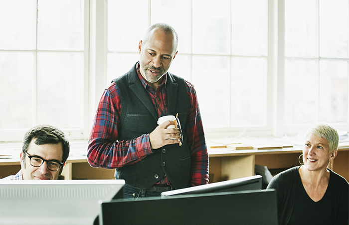 Three People Gathered in Office