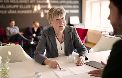 Woman Showing Man Document