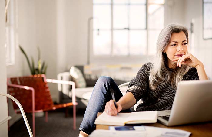 Woman Thinking Taking Notes
