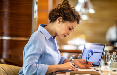 womanreviewingfileswglassesinhand