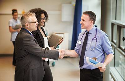 Administrator-Shaking-Hands-with-Doctor