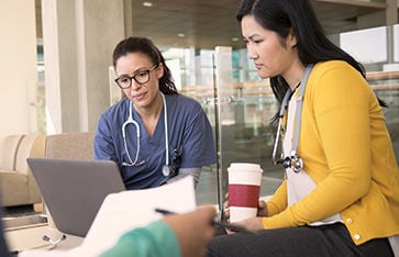 Coworkers Working in Lounge