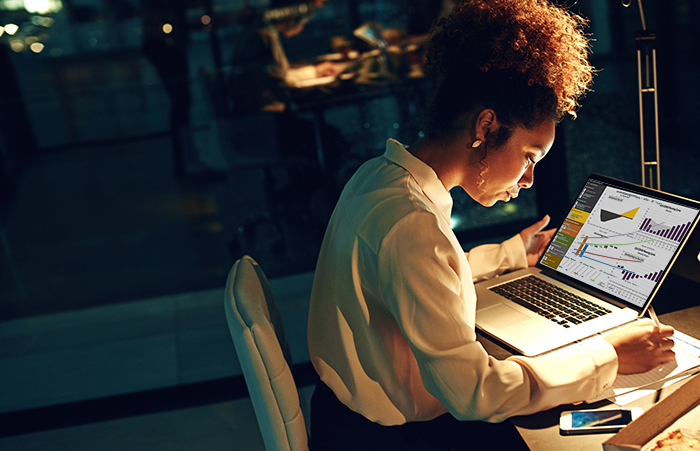 Woman at Computer at Night