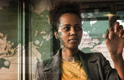 Businesswoman Looking at Global Map