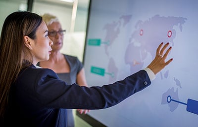 Woman Explaining Geographical Chart