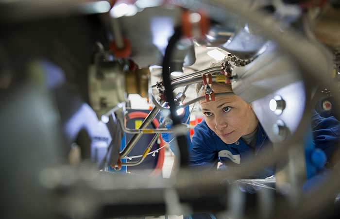 Mechanic Examines Machinery