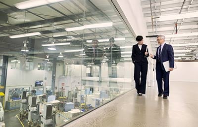 Two Professionals Discussion Window to Facility