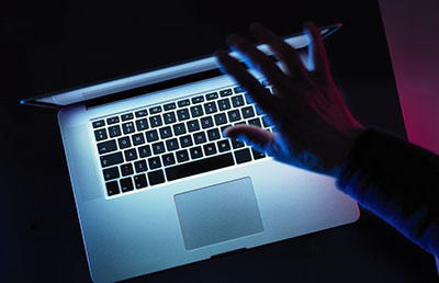 Dark Room Glowing Laptop