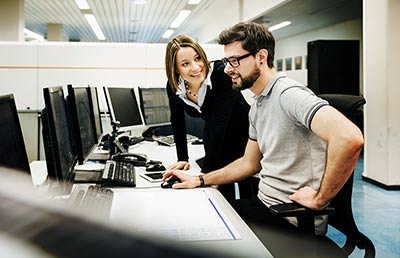 Two IT Professionals in Control Room