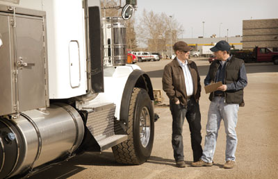 Men Talking By Semi Truck