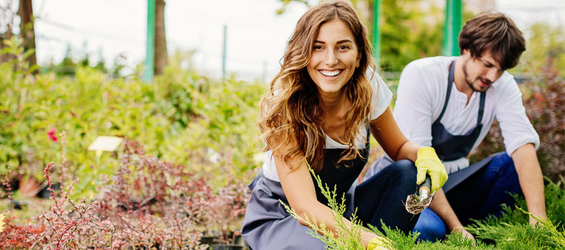 Young couple running a garden center
