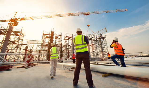 Construction manager and engineer working on building site