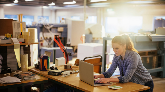 Manufacturing Facility Woman at Work Laptop